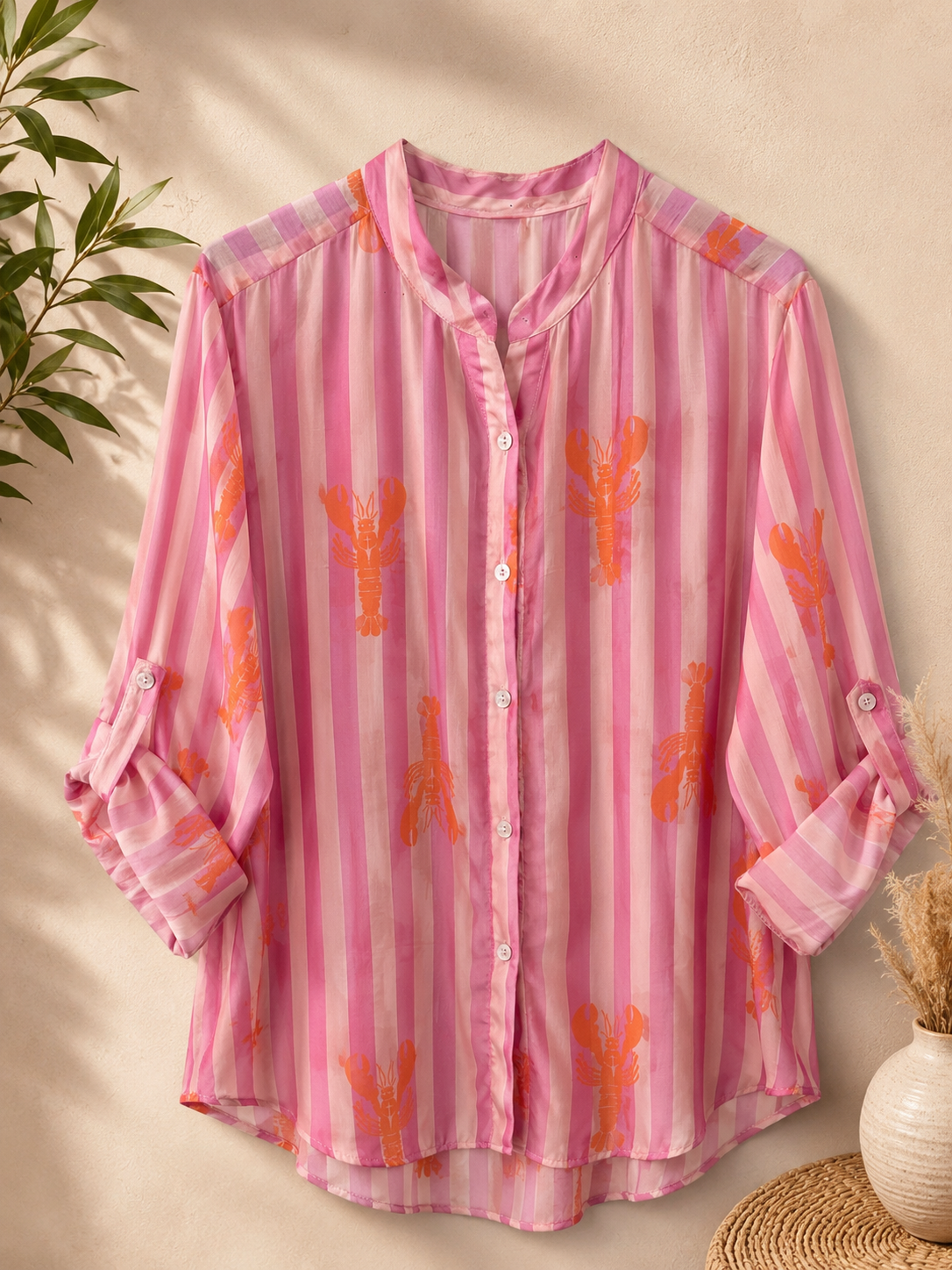 Camicia a righe con stampa rosa