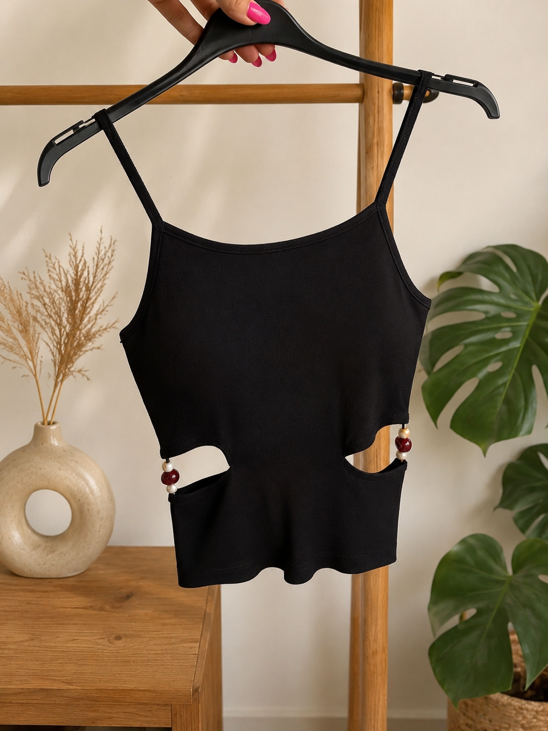 Top a coste con cut out laterali